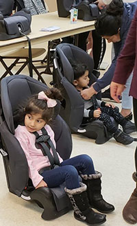 Child in car seat at a car seat workshop at Mid-Hudson METS