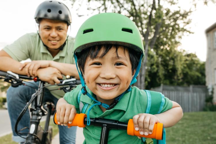 Father and young son on a bike